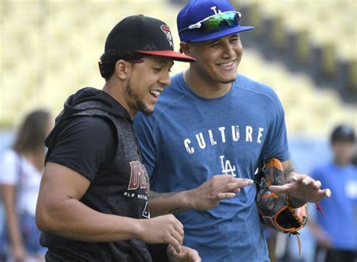 Is Yonder Alonso related to Manny Machado?