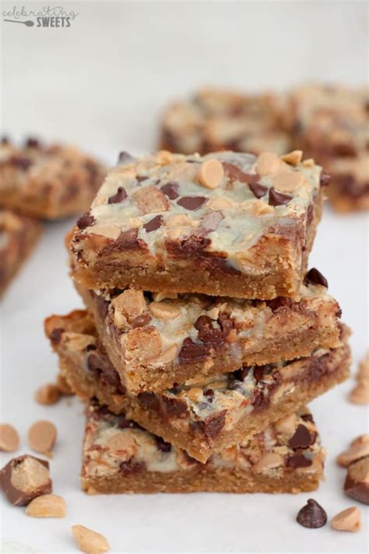 Magic Cookie Bars filled with Peanut Butter Cups and Chocolate